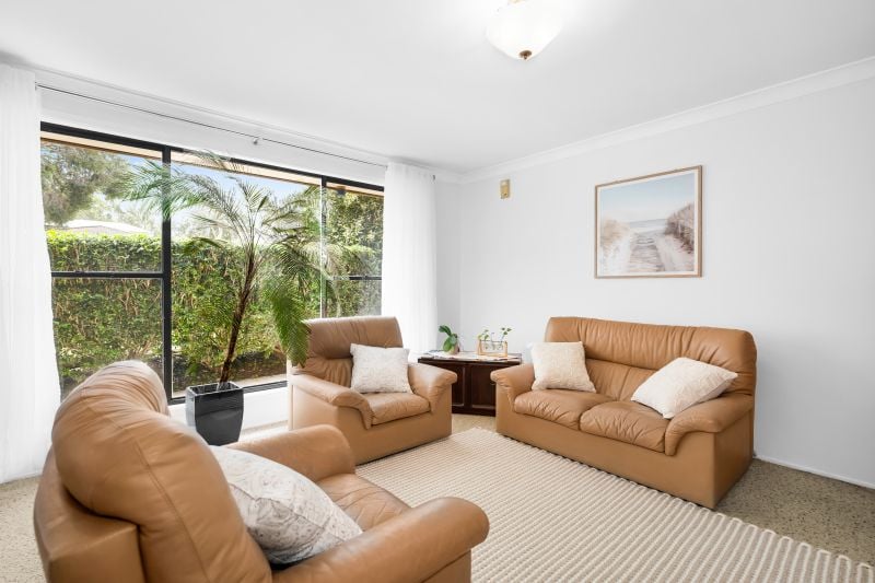 Charming Family Home with Beautiful Landscaped Grounds and Inviting Living Spaces