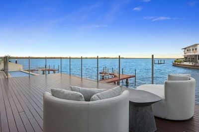 An Elegant Waterfront Masterpiece with Skyline Views