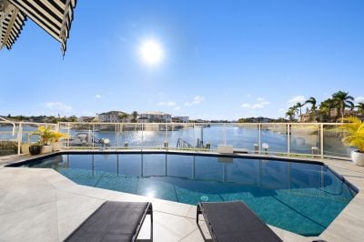 Prime North-Facing Waterfront Home in Renowned Gated Community, featuring Private Swimming Pool and two Marina Berths