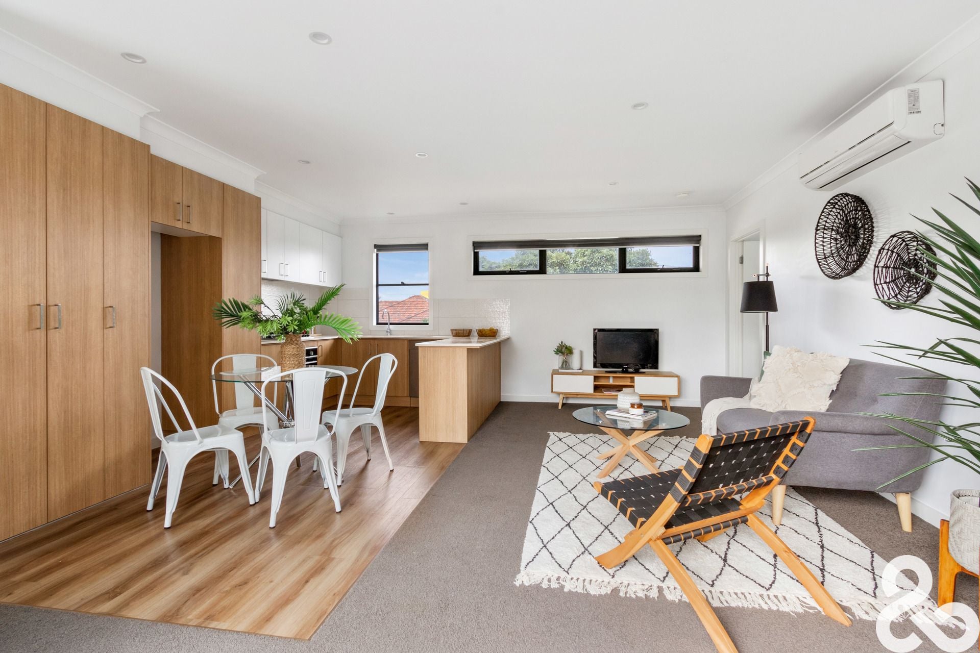 A MUST SEE! Designer Upper-Level Unit in Prime Location
