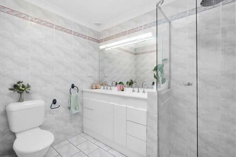 Charming Family Home with Beautiful Landscaped Grounds and Inviting Living Spaces