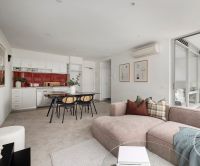 Rare South Yarra Apartment with Floor-to-Ceiling Windows, including bedroom.