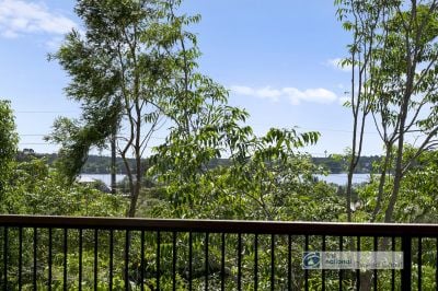 Renovated Coastal Haven with River Views on 1,244sqm Corner Block