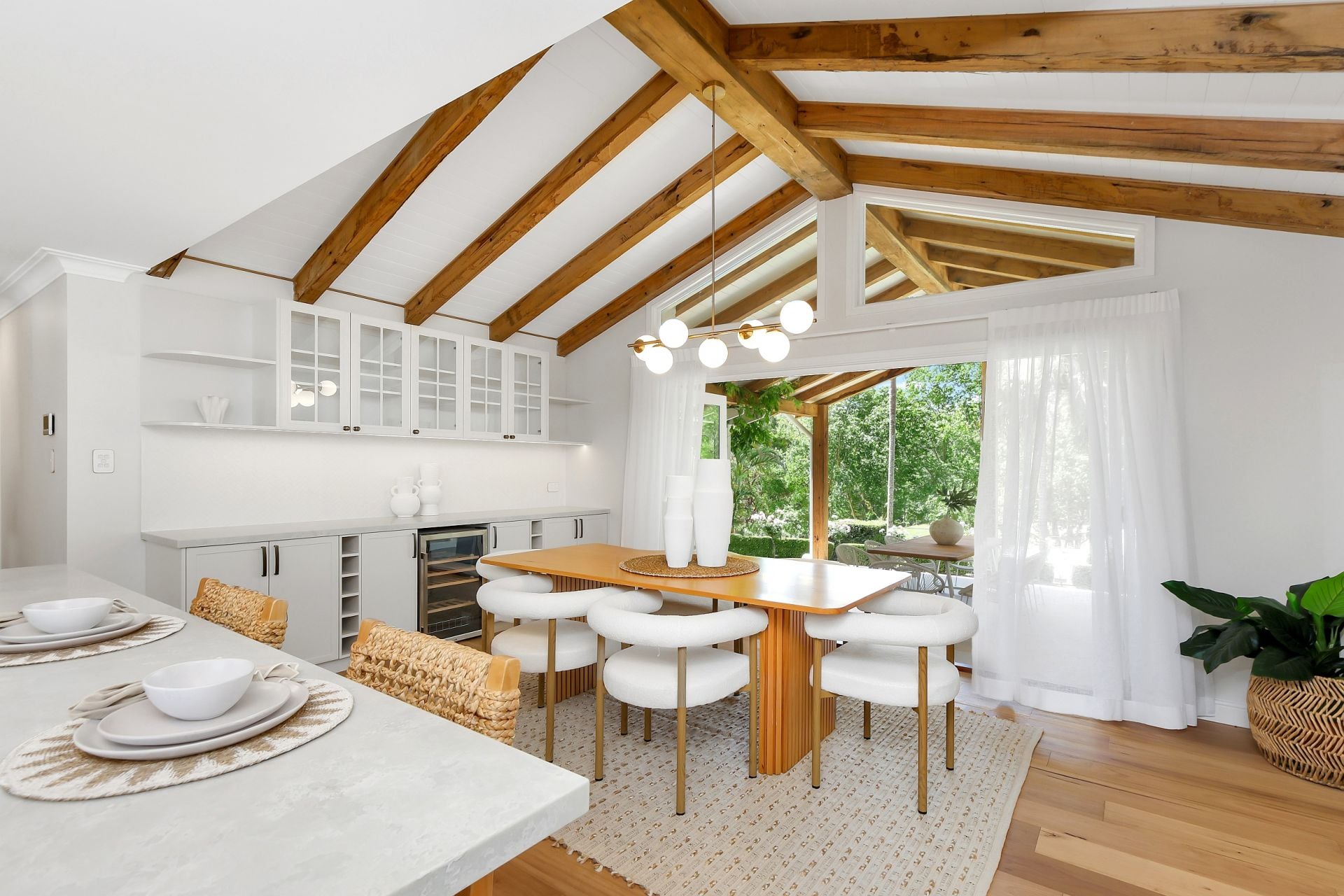 Melody Park — kitchen and dining room, cathedral ceilings, timber beams, open plan