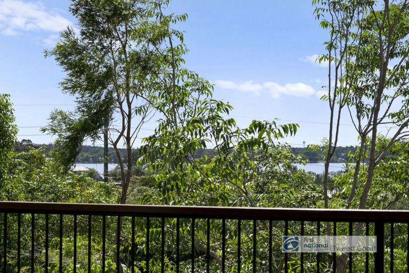 Renovated Coastal Haven with River Views on 1,244sqm Corner Block