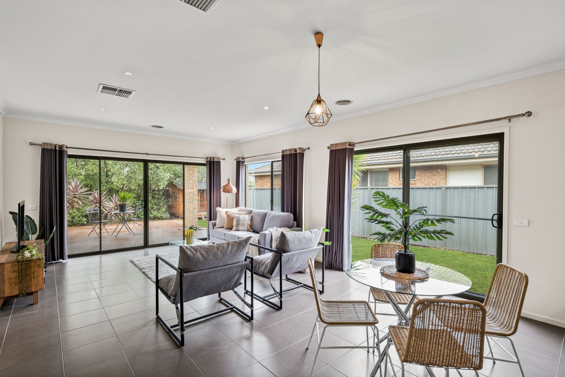Modern Family Living with a Study, Large Deck, and Generous Backyard