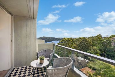 Sunlit top-floor living with views over Berry's Bay & North Sydney skyline