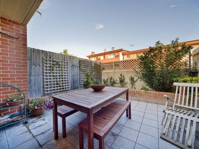SPLIT LEVEL TOWNHOUSE IN TIGHTLY HELD COMPLEX WITH PRIVATE COURTYARD