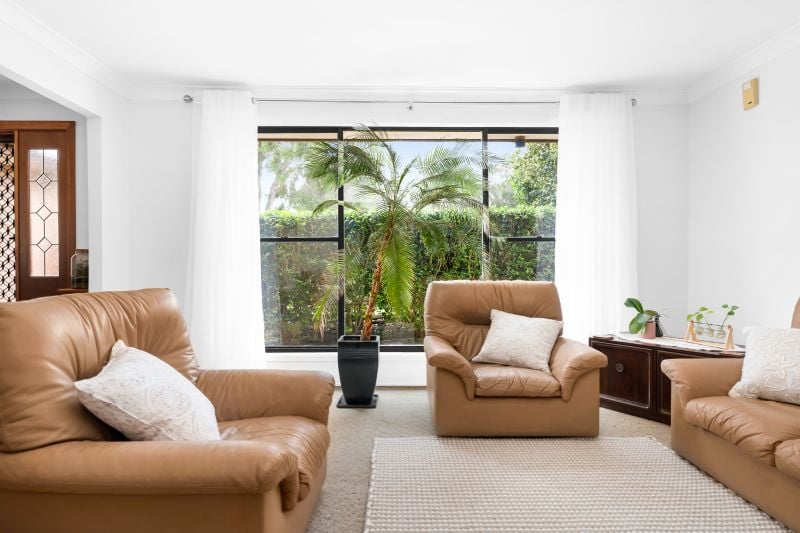 Charming Family Home with Beautiful Landscaped Grounds and Inviting Living Spaces