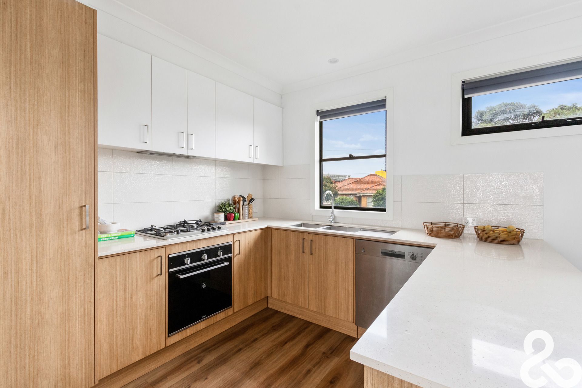 A MUST SEE! Designer Upper-Level Unit in Prime Location